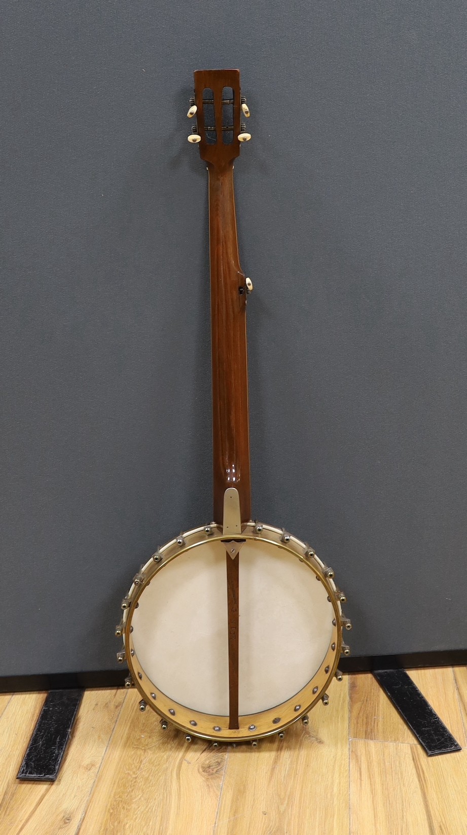 A cased Reliance banjo, 88cms long